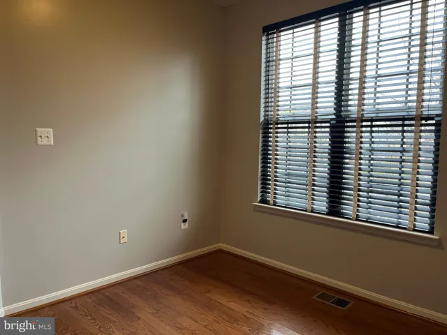 a bathroom with a sink vanity and toilet