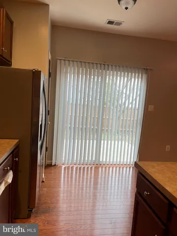 a backyard of a house with wooden fence