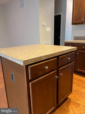 a kitchen with a stove and a microwave