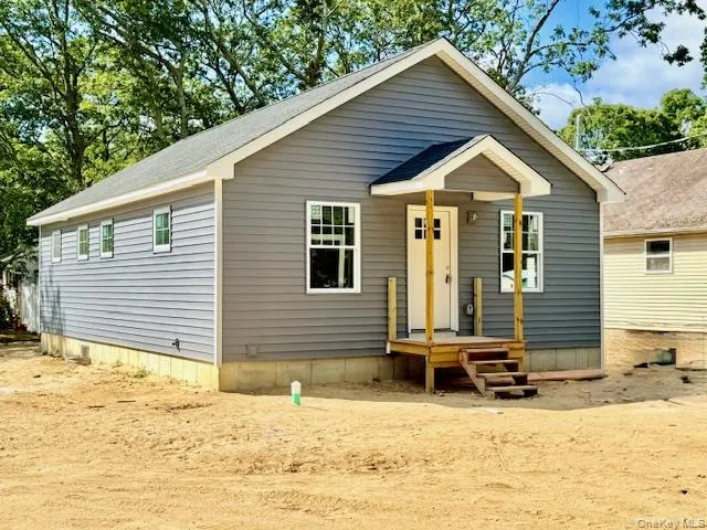 a view of a house with snow on the roof