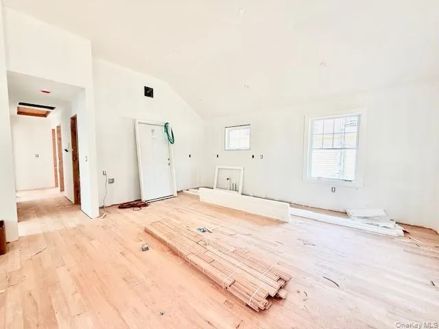 a large white bed in a white room