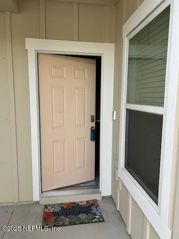 a kitchen with stainless steel appliances granite countertop a sink a refrigerator and a granite counter tops