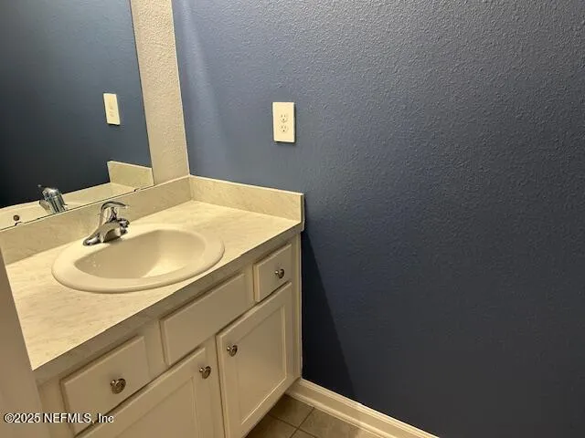 a view of a field with a tree