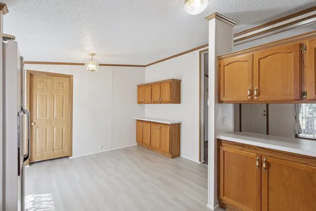 a view of a kitchen with a sink and cabinets