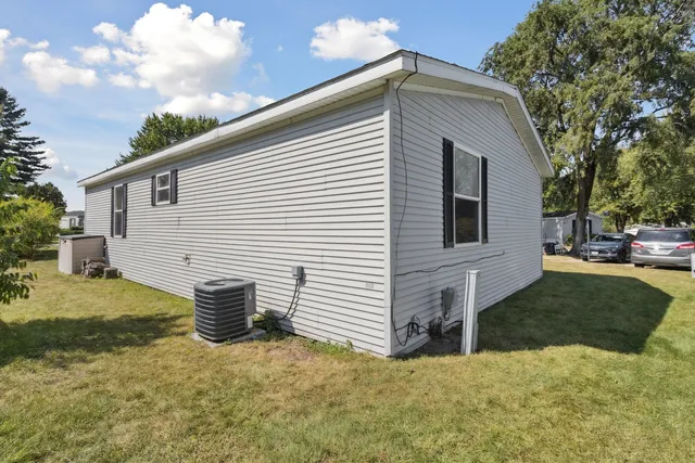a view of backyard of house with entertaining space