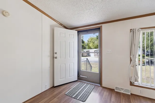 a view of entryway with wooden floor