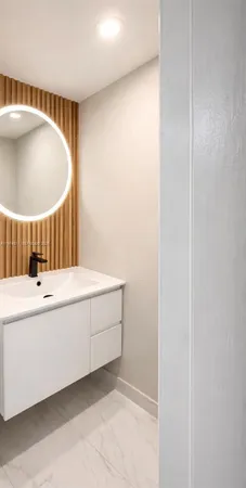 a bathroom with a bathtub and a sink