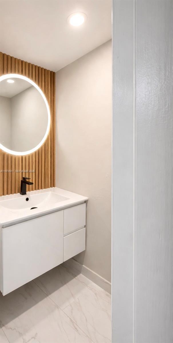 5935 West 16th Lane Hialeah, FL 33012 - Photo 12 of 15 a bathroom with a bathtub and a sink