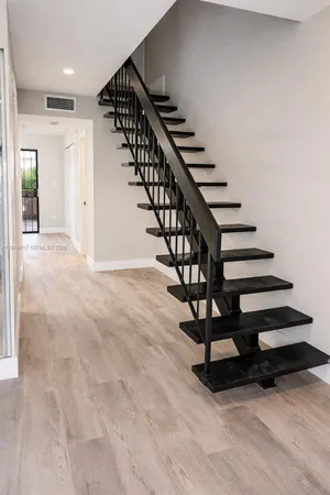 a view of entryway with wooden floor