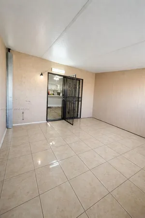 a view of an empty room with windows