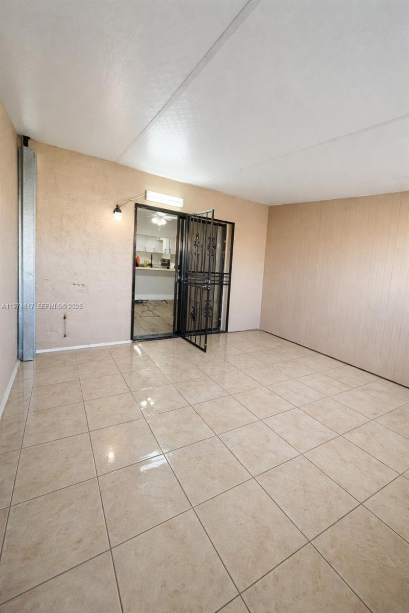 5935 West 16th Lane Hialeah, FL 33012 - Photo 4 of 15 a view of an empty room with windows