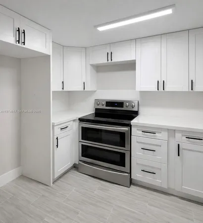 a kitchen with cabinets and appliances
