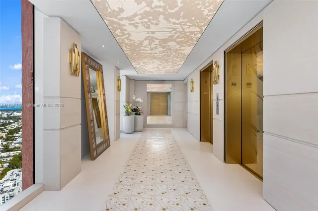 a view of hallway with furniture and a shower