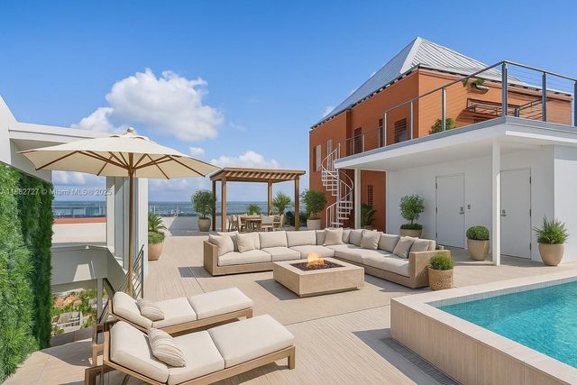 a view of a patio with couches table and chairs with potted plants