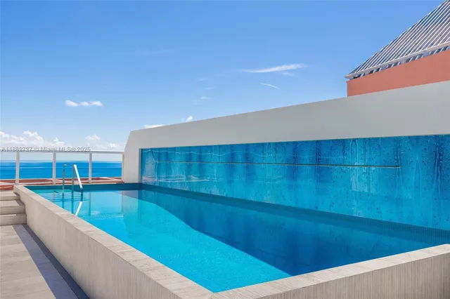 a swimming pool with a outdoor seating