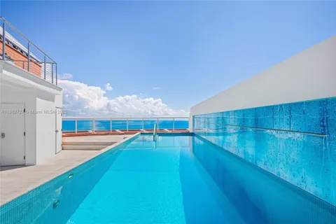 a balcony with furniture and a potted plant