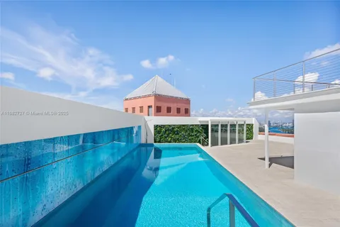 a balcony with table and chairs