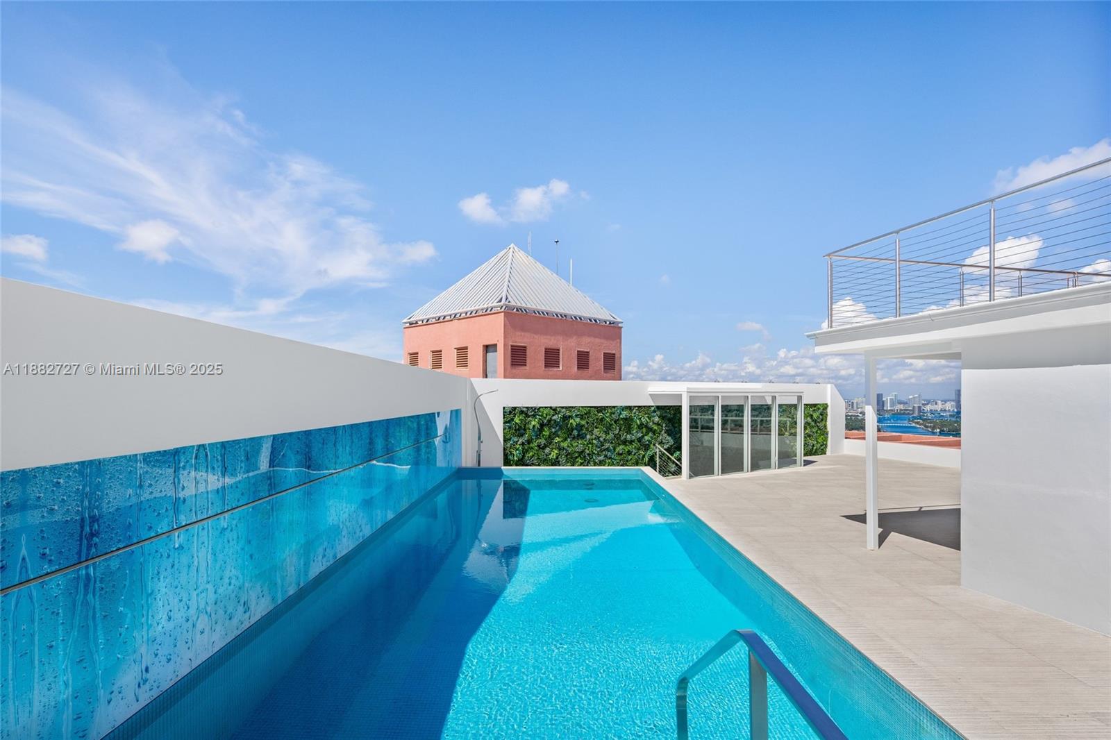 300 South Pointe Drive, Unit PH5 Miami Beach, FL 33139 - Photo 31 of 52 a swimming pool with a outdoor seating