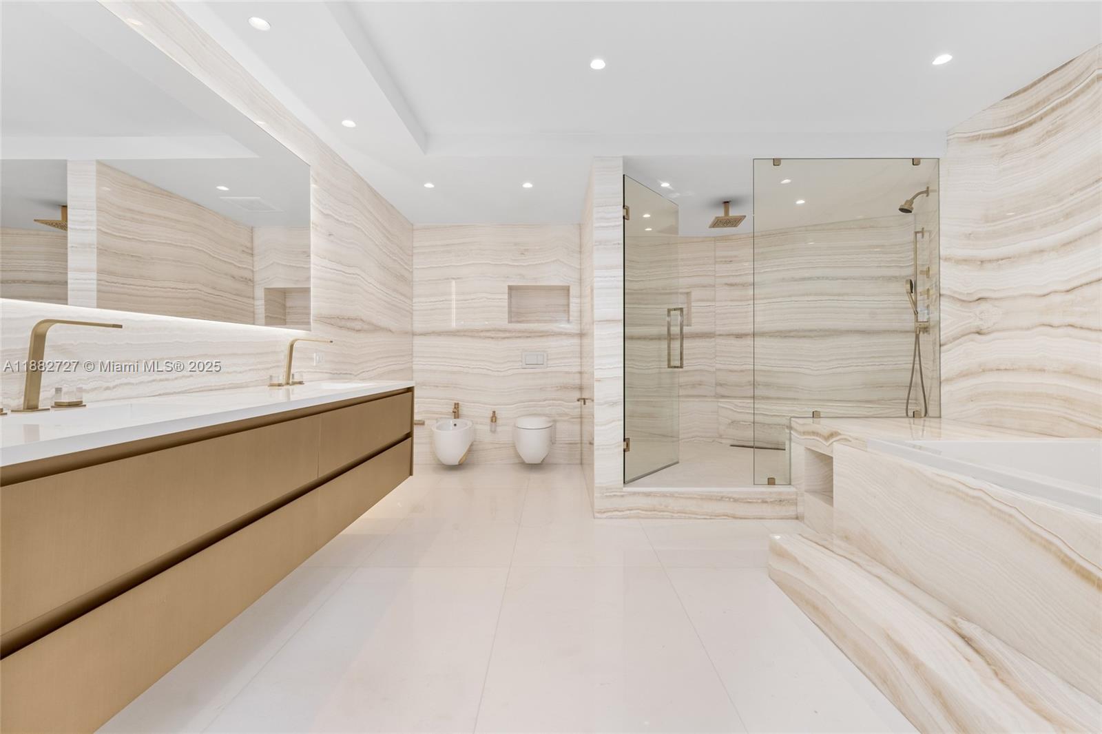 300 South Pointe Drive, Unit PH5 Miami Beach, FL 33139 - Photo 39 of 52 a bathroom with a bathtub and a shower