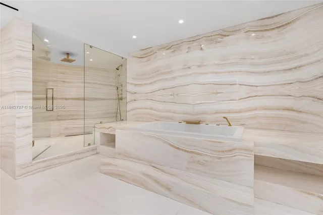 a spacious bedroom with a bed and a large window