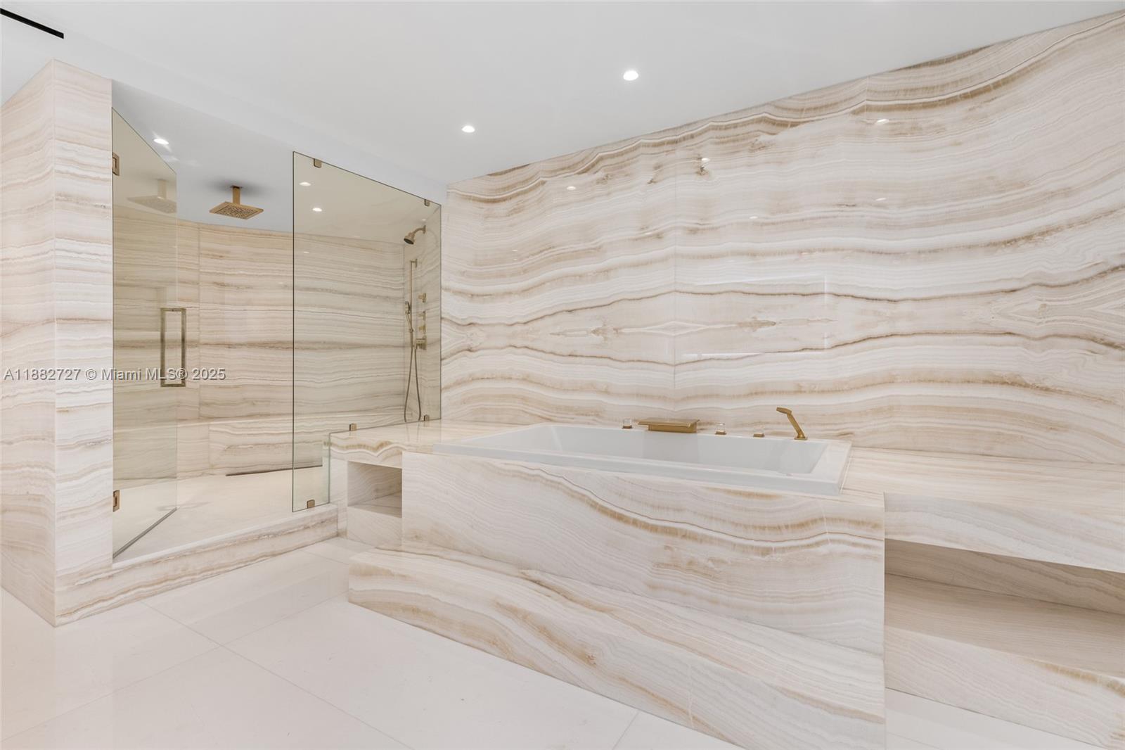 300 South Pointe Drive, Unit PH5 Miami Beach, FL 33139 - Photo 40 of 52 a bathroom with a bathtub and a shower