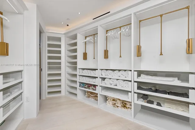 a bathroom with a shower sink and mirror