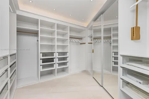 a bedroom with a bed and a night stand