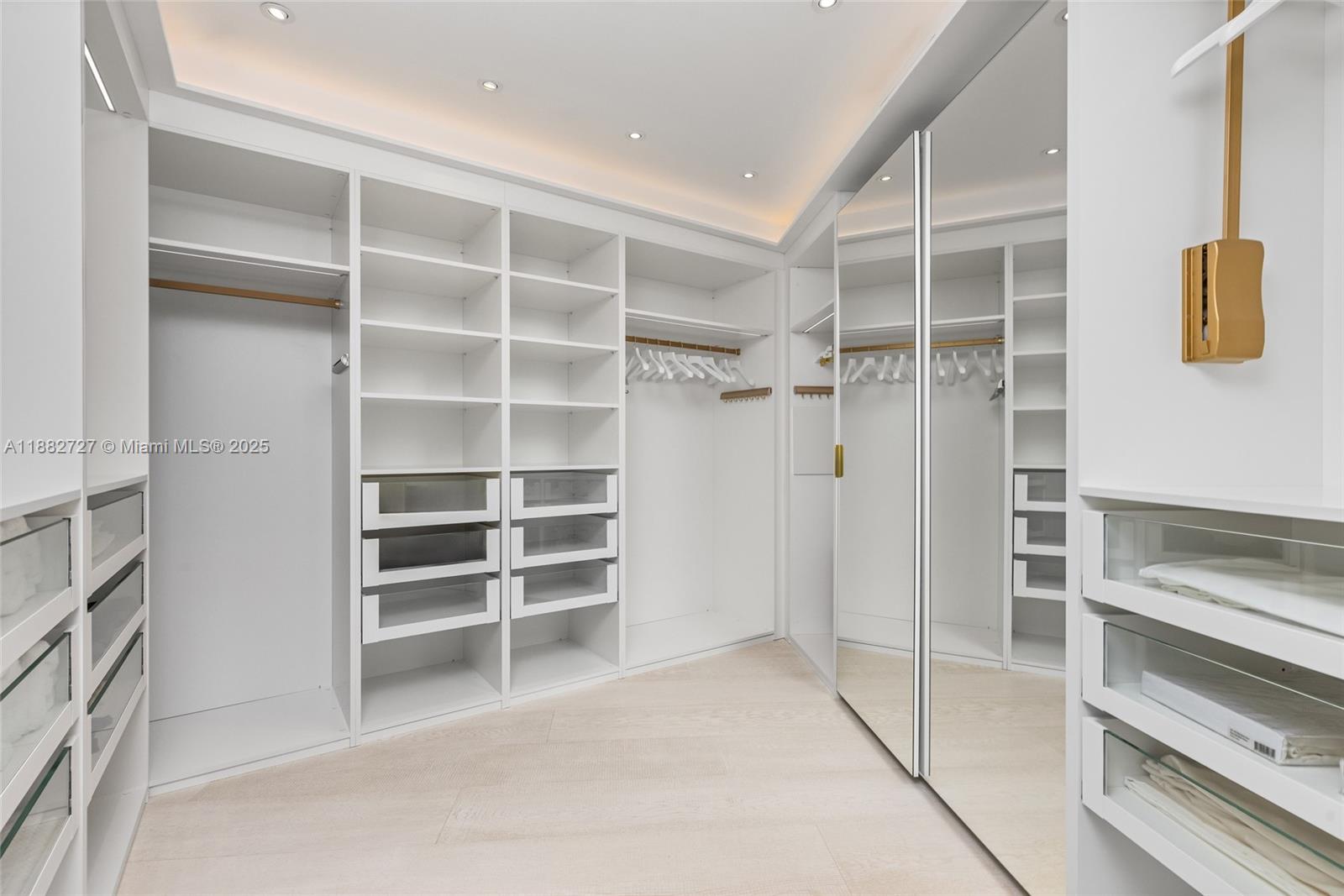 300 South Pointe Drive, Unit PH5 Miami Beach, FL 33139 - Photo 42 of 52 a view of an empty room with empty shelves