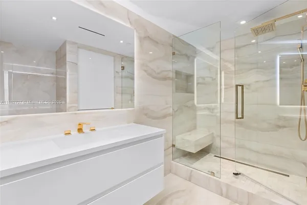 a bathroom with a sink and cabinets