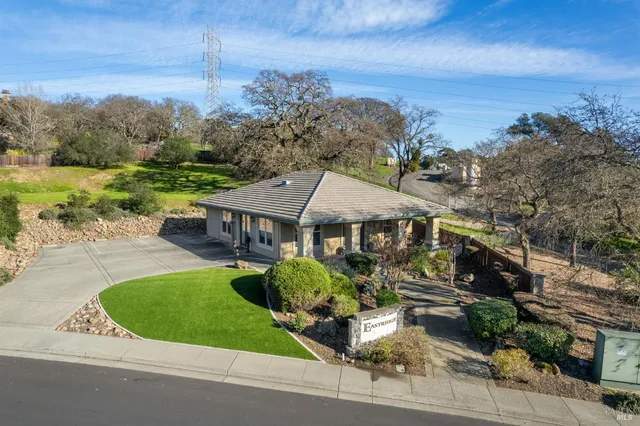front view of a house with a garden