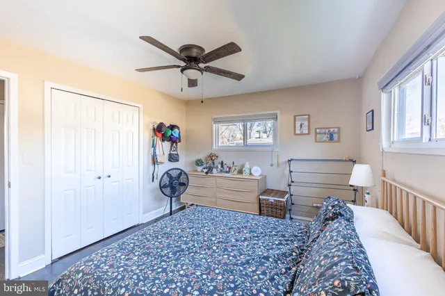 a bedroom with furniture and a window