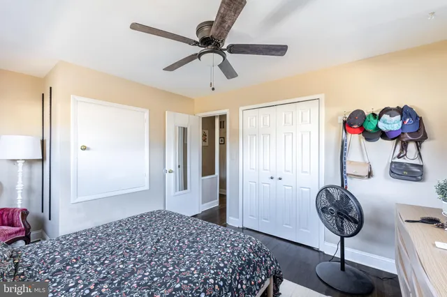 a bedroom with a bed and chandelier