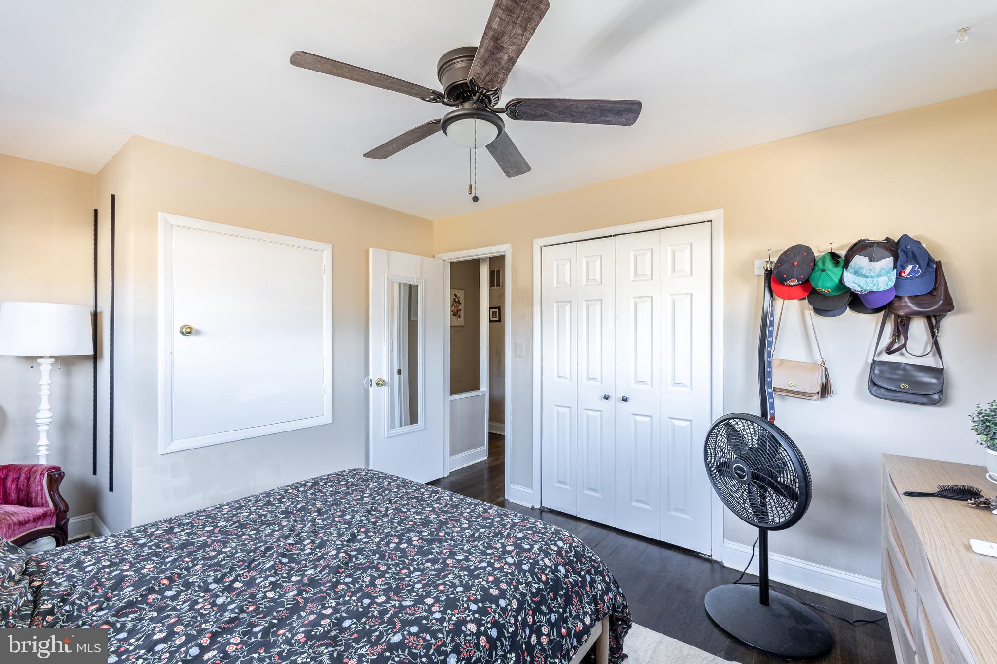 10611 Maple Street Fairfax, VA 22030 - Photo 12 of 20 a bedroom with a bed and chandelier
