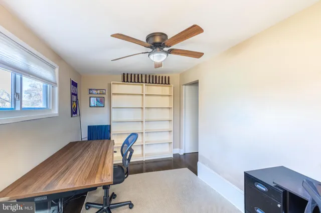 a workspace with furniture and window