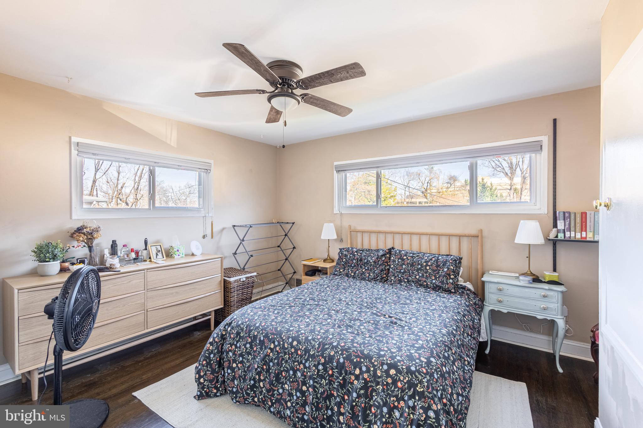 10611 Maple Street Fairfax, VA 22030 - Photo 10 of 20 a bedroom with a bed and a chandelier