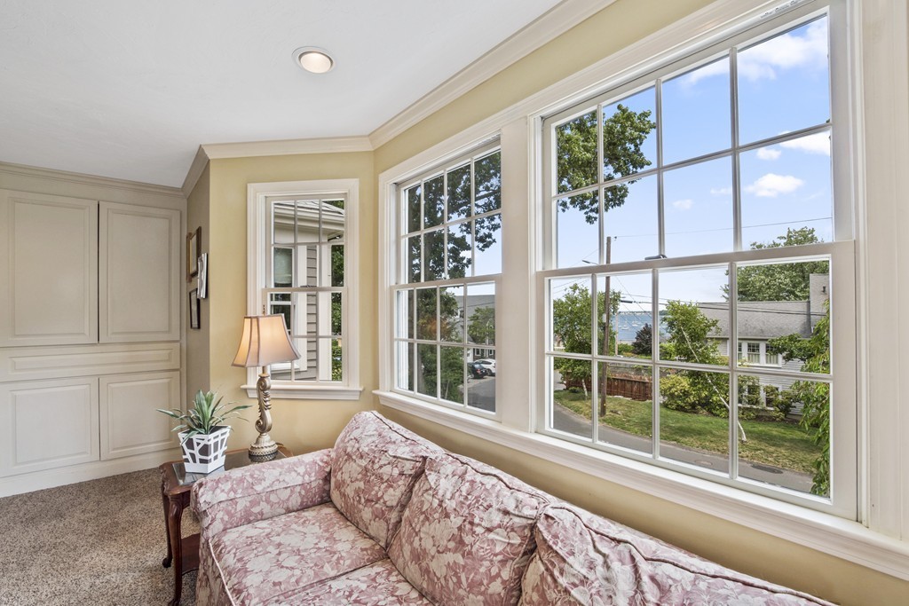 26 Howe Street Hingham, MA 02043 - Photo 18 of 30 a bedroom with a large window and a bed