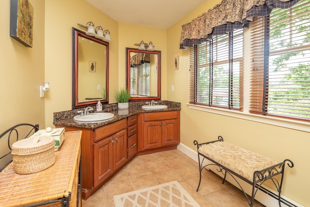 26 Howe Street Hingham, MA 02043 - Photo 19 of 30 a bathroom with a granite countertop sink and a toilet