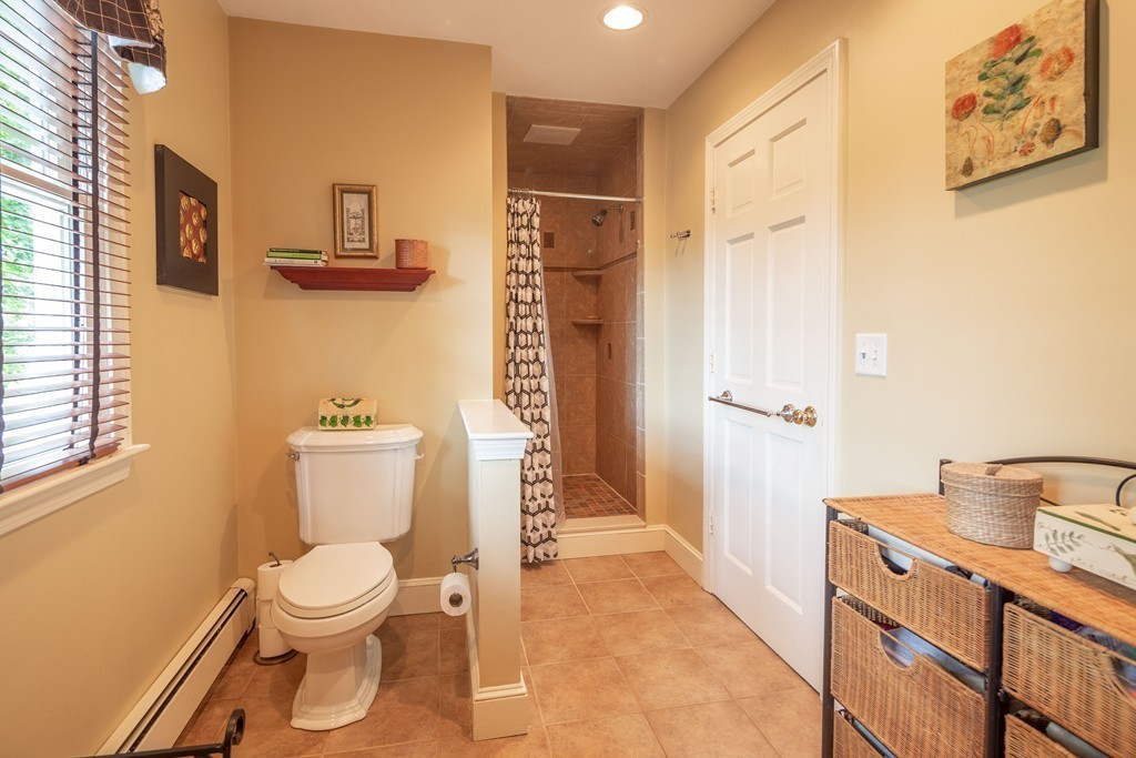 26 Howe Street Hingham, MA 02043 - Photo 20 of 30 a bathroom with a toilet sink and tub