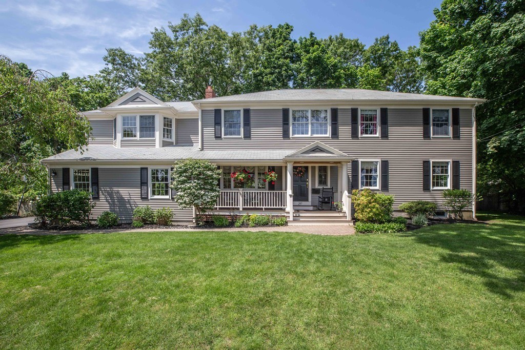 26 Howe Street Hingham, MA 02043 - Photo 2 of 30 a front view of a house with a yard