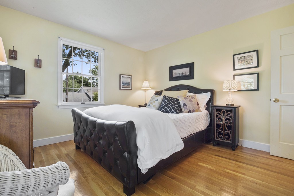 26 Howe Street Hingham, MA 02043 - Photo 23 of 30 a bedroom with a bed and a couch