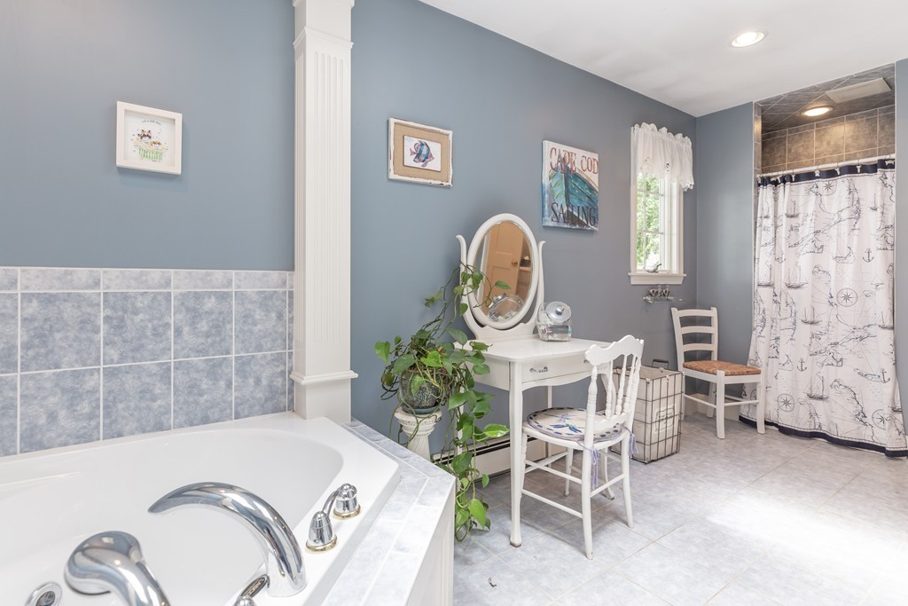 26 Howe Street Hingham, MA 02043 - Photo 25 of 30 a living room with chairs and a table