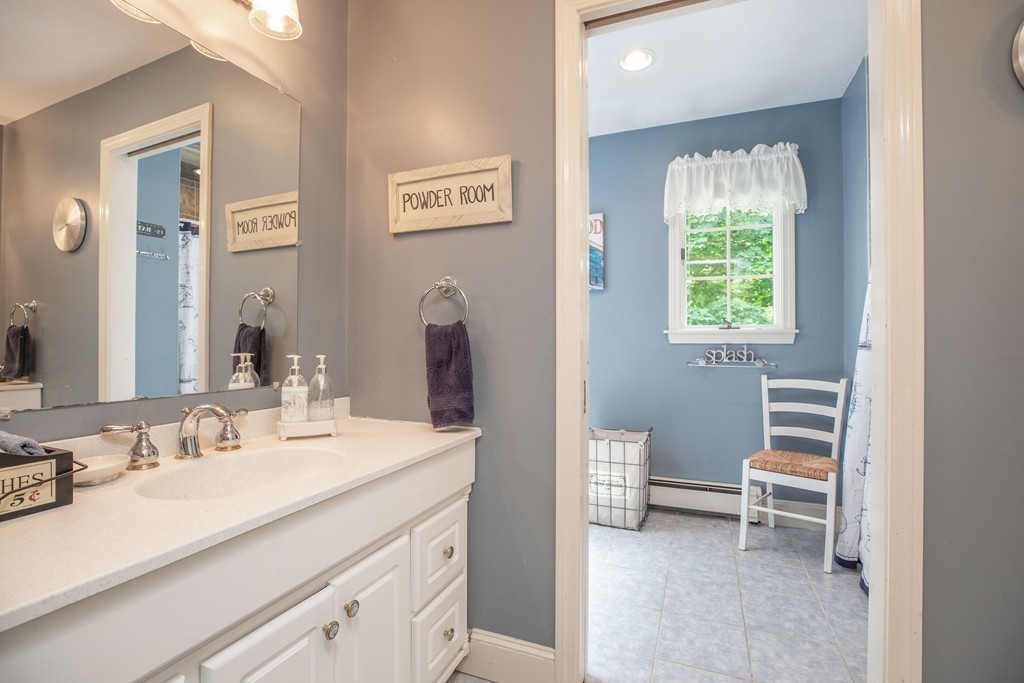 26 Howe Street Hingham, MA 02043 - Photo 26 of 30 a bathroom with a sink double vanity and a toilet
