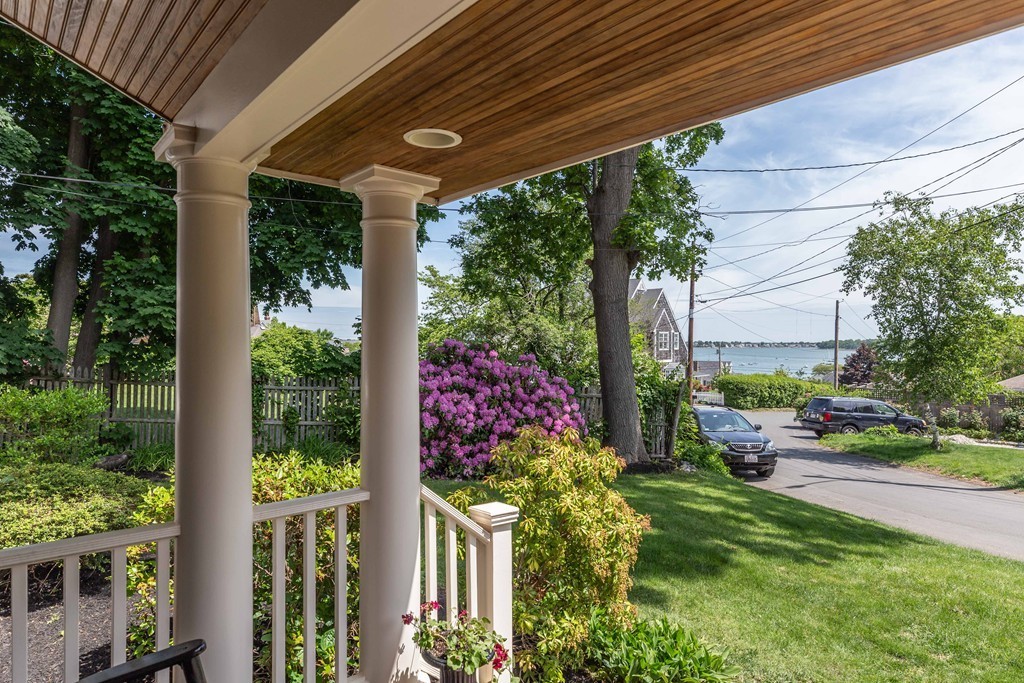 26 Howe Street Hingham, MA 02043 - Photo 3 of 30 a garden filled with lots of potted plants and a bench