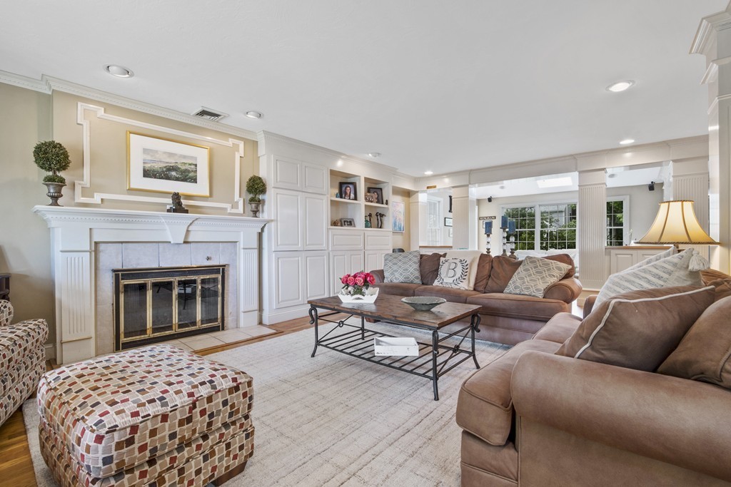 26 Howe Street Hingham, MA 02043 - Photo 8 of 30 a living room with furniture and a fireplace
