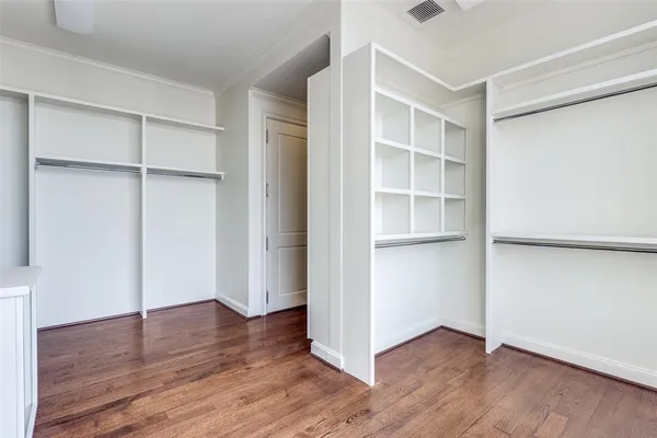 a view of an empty walk in closet