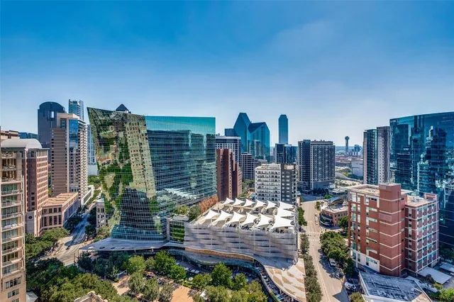 a view of a building with potted plants
