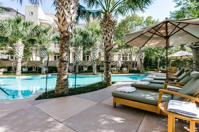 a view of a swimming pool with a patio