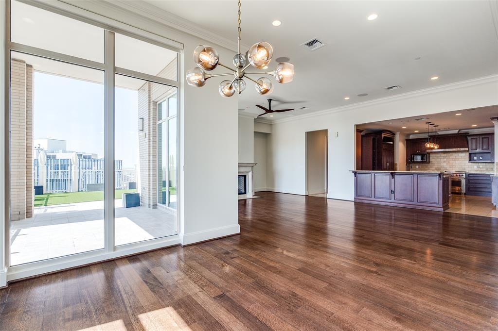 2555 North Pearl Street, Unit 2001 Dallas, TX 75201 - Photo 5 of 36 a view of a big room with wooden floor and windows