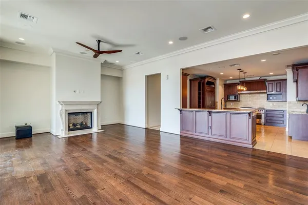 a view of a kitchen with a sink a fireplace and a kitchen