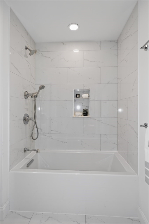 23 Stearns Road Belmont, MA 02478 - Photo 29 of 42 a bathroom with a bathtub and a shower